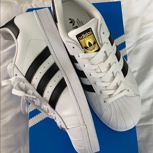 Black and white ADIDAS Superstars